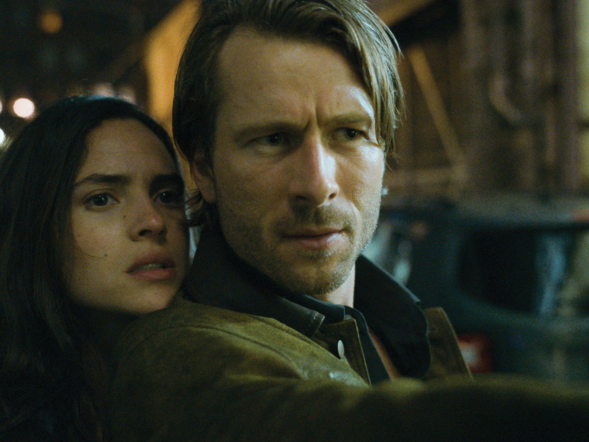 Adria Arjona and Glen Powell in Hit Man