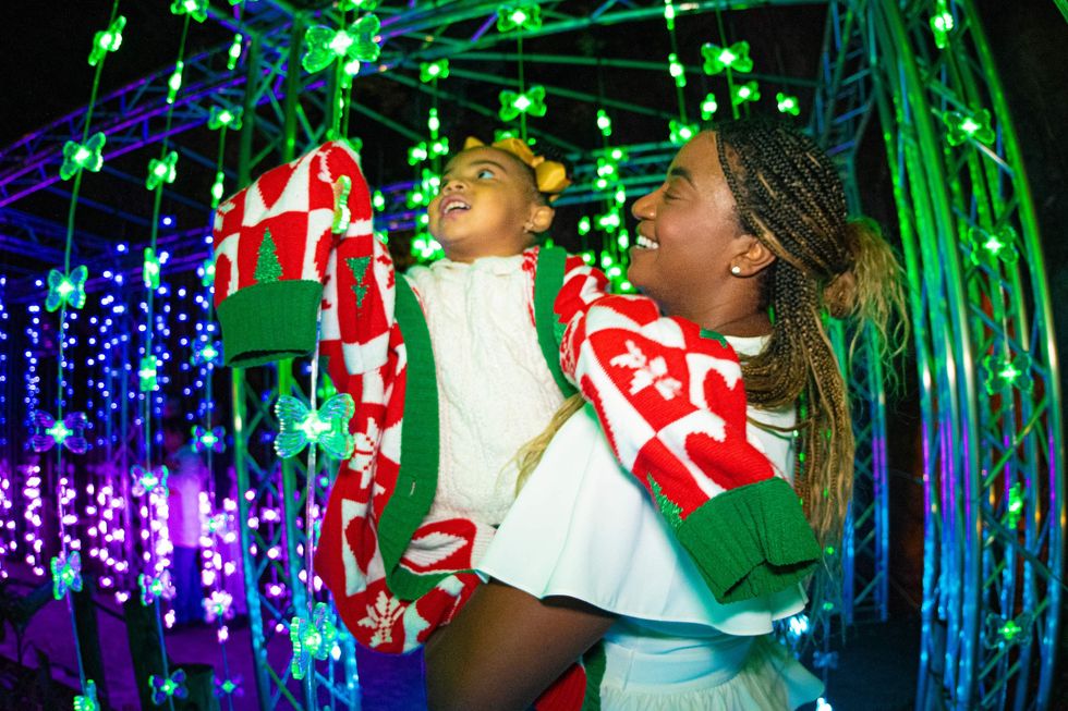 Adult woman and child at the Houston Zoo's Zoo Lights
