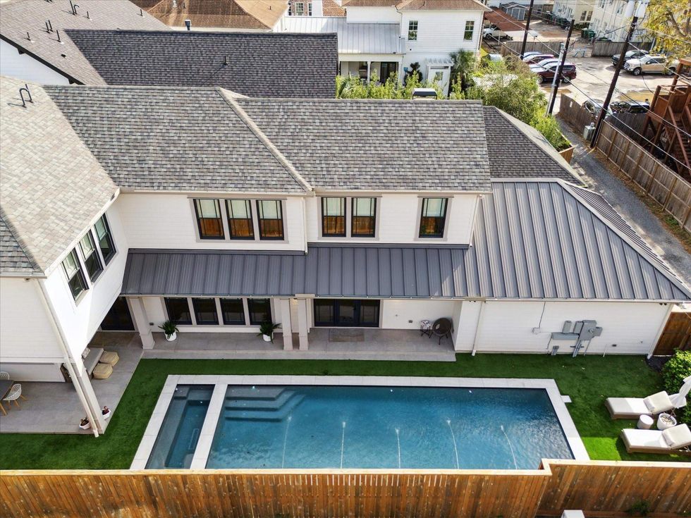 Aerial view of 1039 Harvard Street showing the backyard and pool