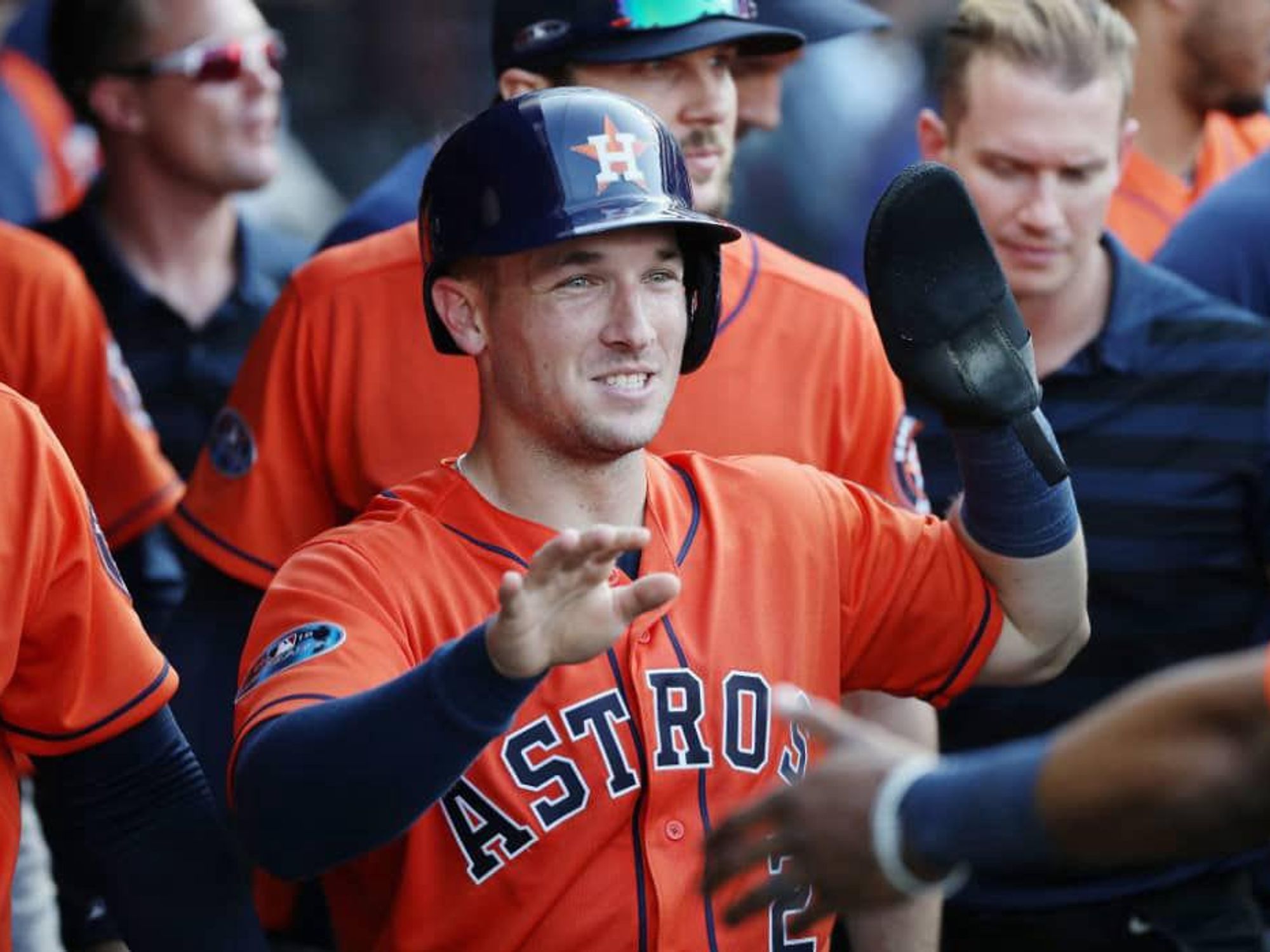 Alex Bregman high 5 five Astros orange jersey close up