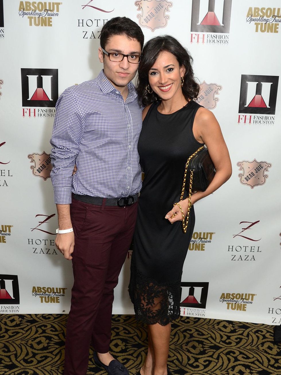 Amir Taghi and Maryam Afshari wearing Amir Taghi at the Fashion Houston Launch Party October 2013