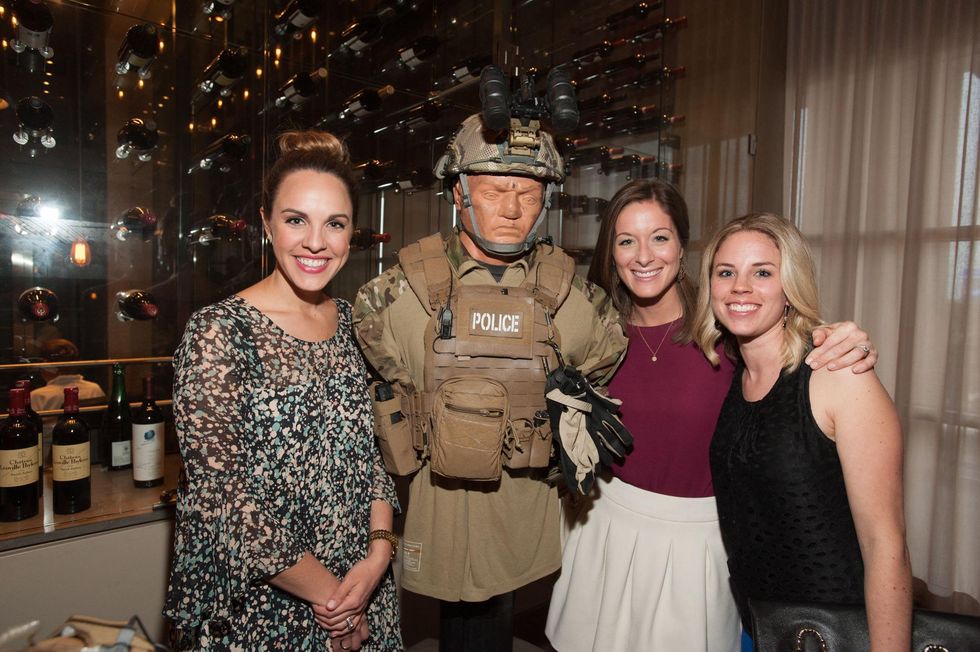 Angelina Shanklin, from left, Allie Hodges and Maggie Weathersby with police dummy at the Houston Police Department benefit April 2015