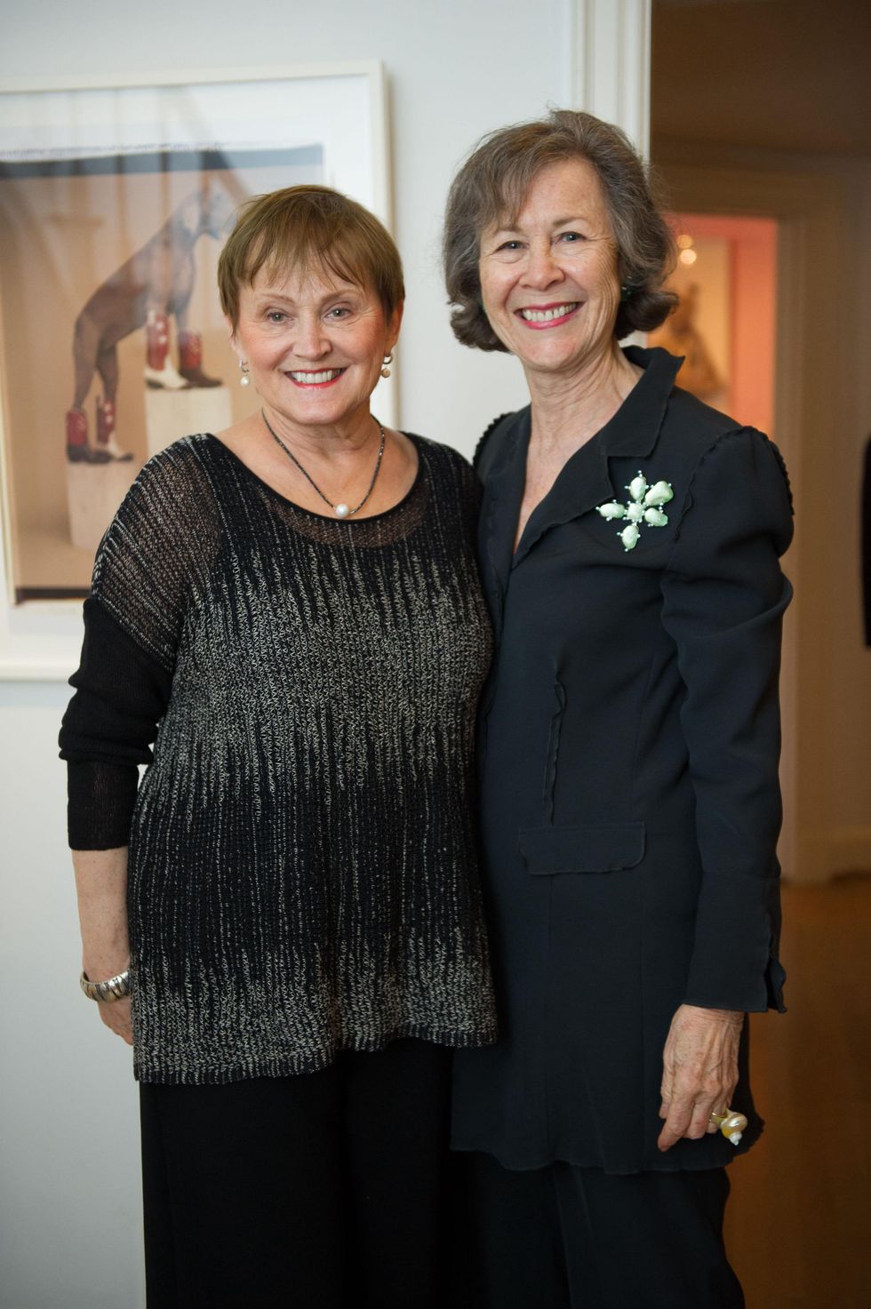 Anne Graubart and Kathryn Rabinow with the William Wegman photograph in background at Planned Parenthood Fine Art Auction