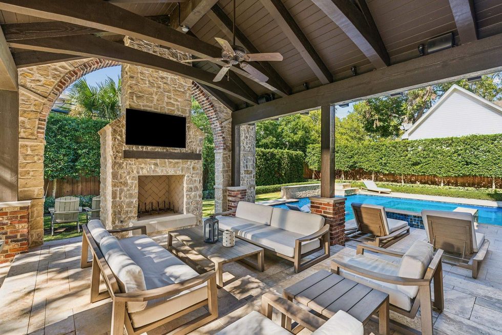 Another view of the outdoor space of 6426 Sewanee Avenue, showing the covered patio looking out to the pool.