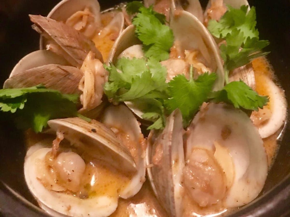 Littleneck clams arrive in a Thaistyle red curry broth. CultureMap