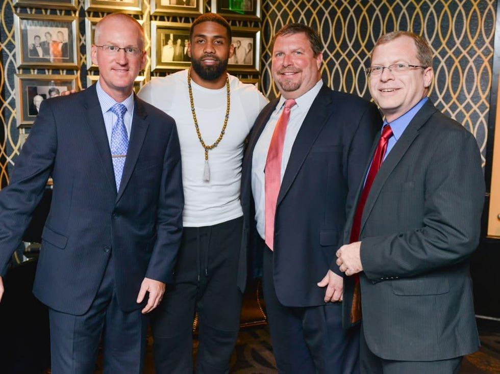 Arian Foster charity dinner Morton's Morton's The Steakhouse Executives Scott Crain, Tom Kohler, GM Eric Kresse with Arian Foster