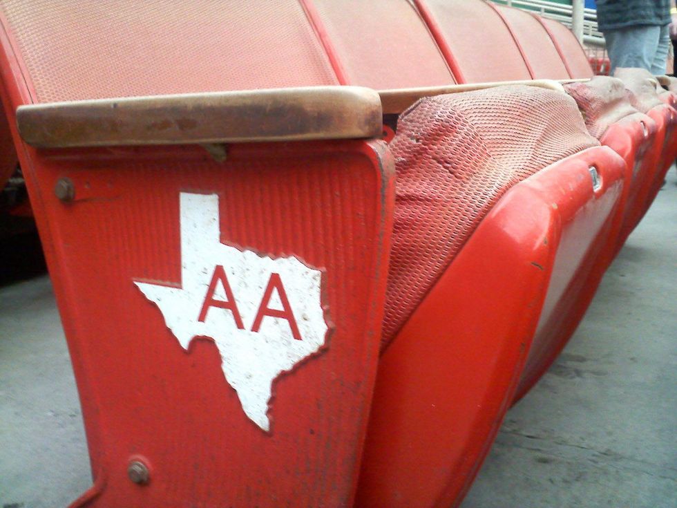 Astrodome orange seats cracked with Texas emblem