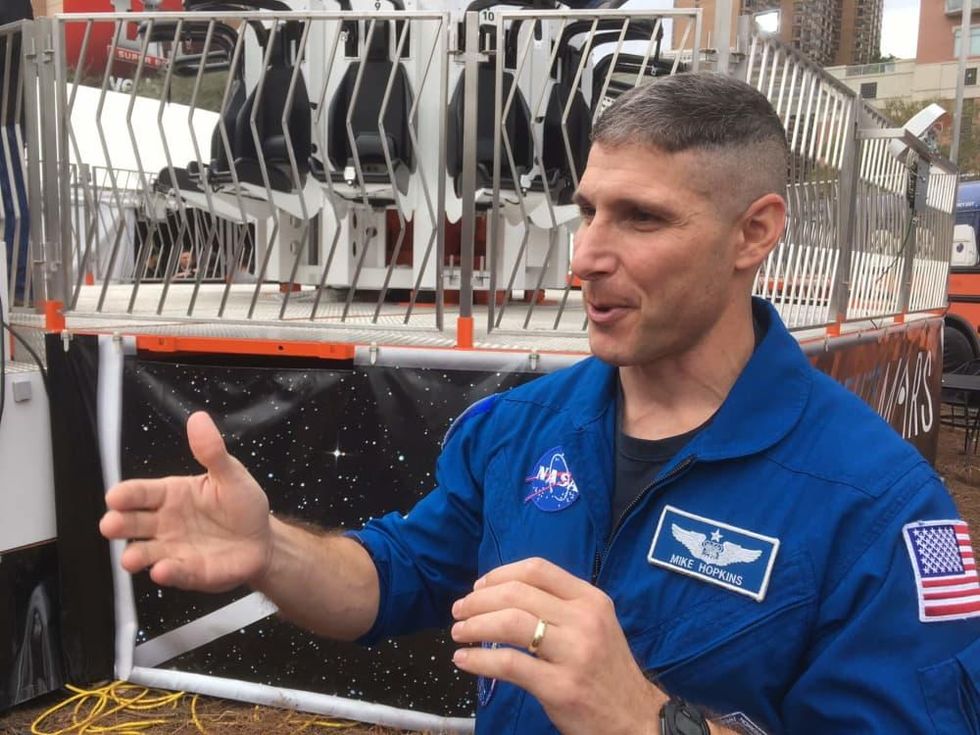 Astronaut Mike Hopkins explains the Future Flight ride at Super Bowl Live
