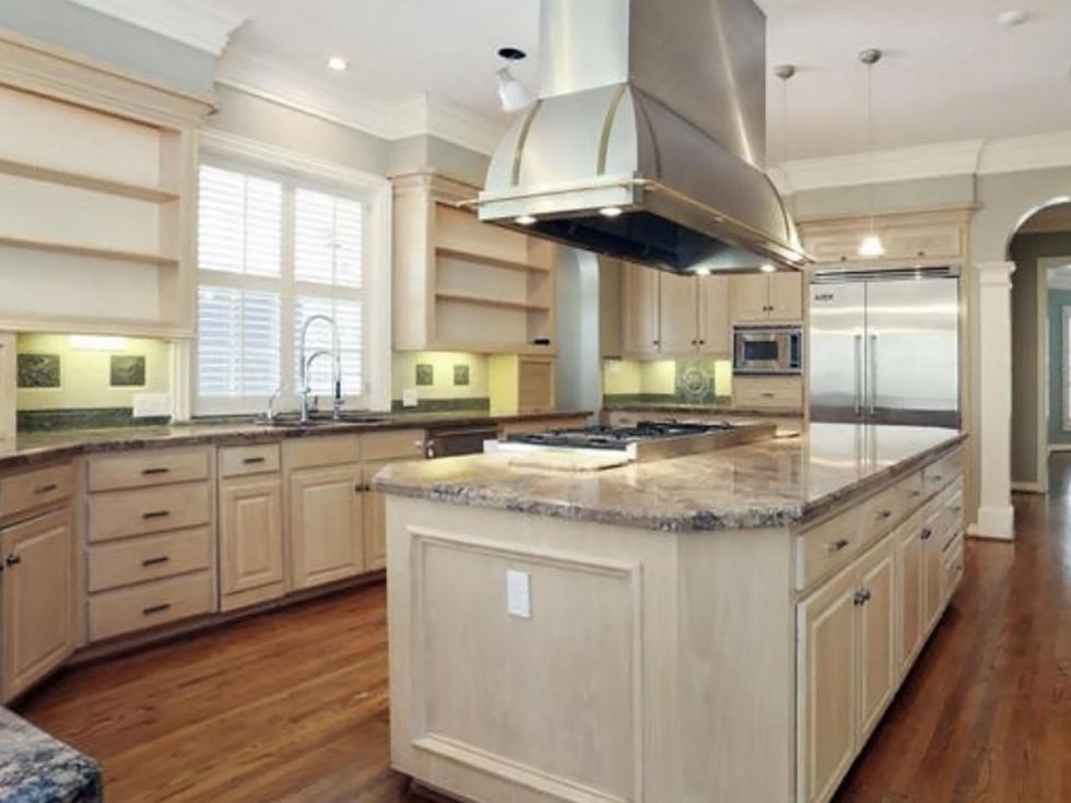 Astros $100 million man Carlos Lee sells Sugar Land mansion November 2014 kitchen to dining room