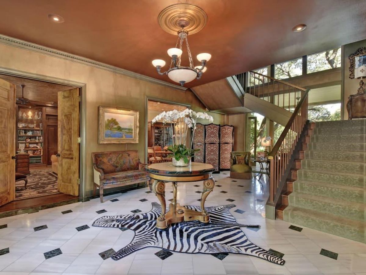 A grand twostory entry with marble floors greets guests. CultureMap