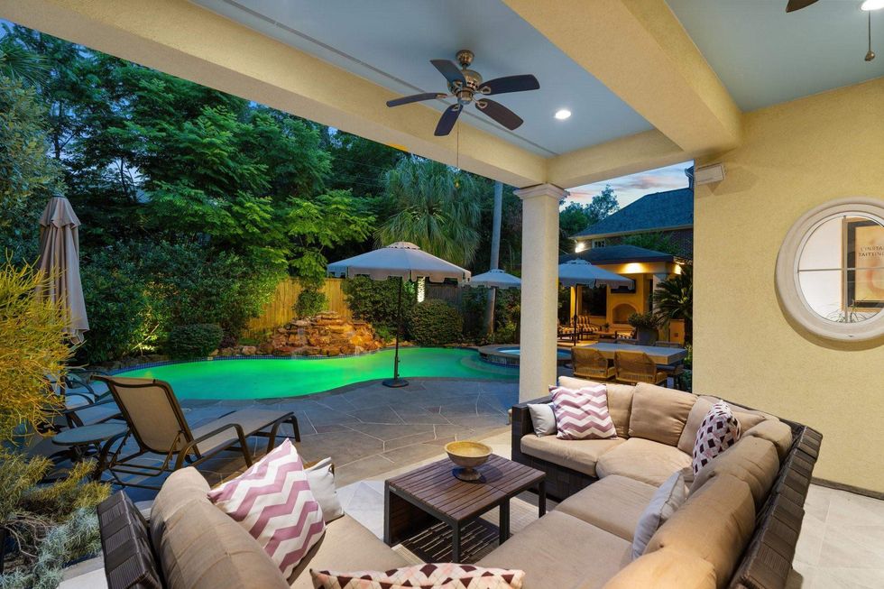 Backyard of 38 Hackberry Lane showing the pool and two patio areas