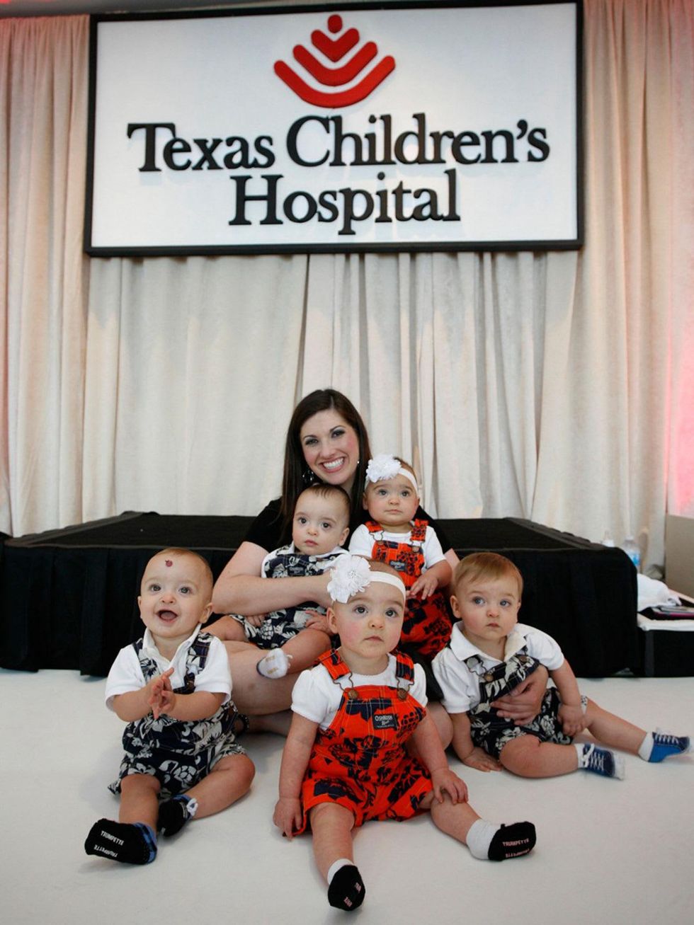 Bad Pants fashion show at Texas Children's August 2013 Quintuplets Sarah Plauche, of Lake Charles, LA, poses with her quintuplets Reece, Tessa, Owen, Miles THIS.jpg