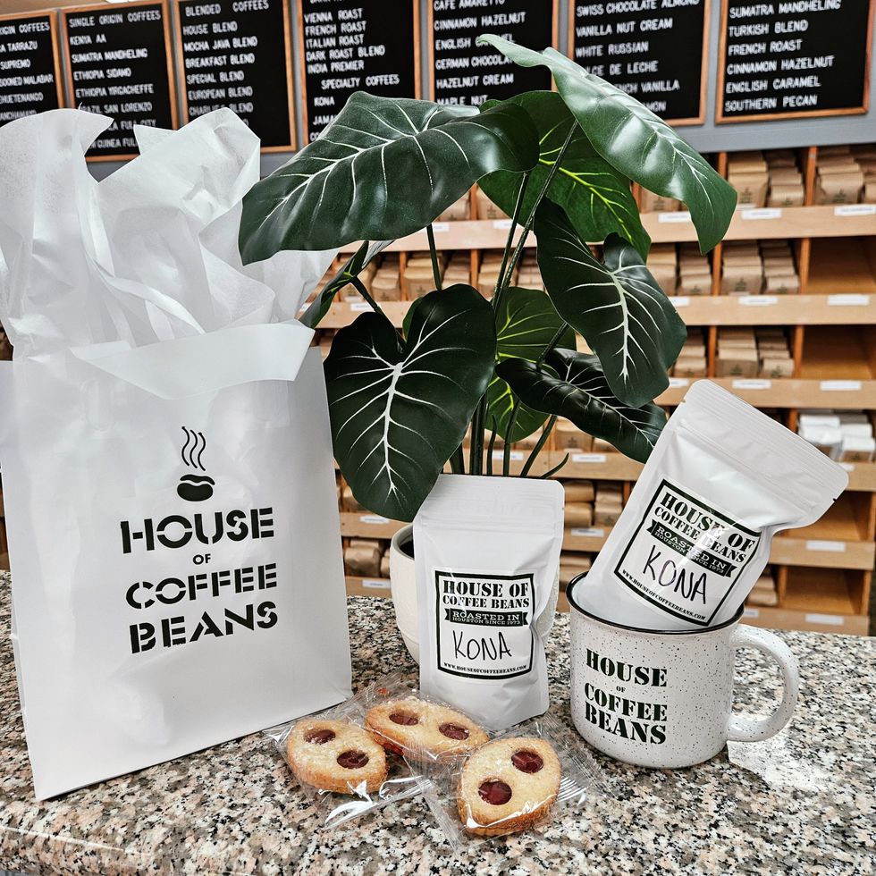 Bags of Kona coffee and raspberry cookies at House of Coffee Beanas