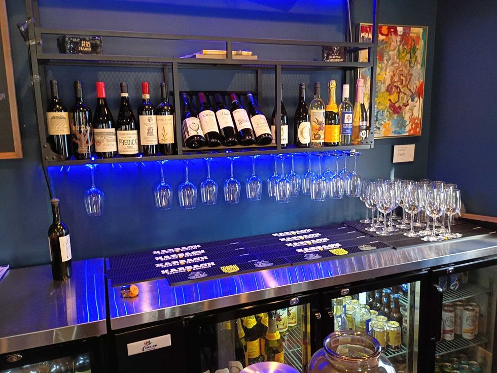 Bar with bottles of wine and glasses