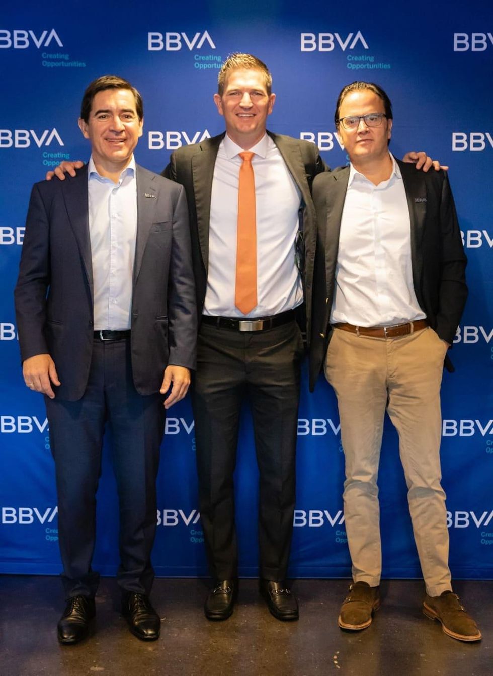 BBVA Group Executive Chairman Carlos Torres Vila (left), Dynamo former player Bobby Boswell (center), and BBVA USA President and CEO Javier Rodriguez Soler (right) at the BBVA Stadium press conference in Houston