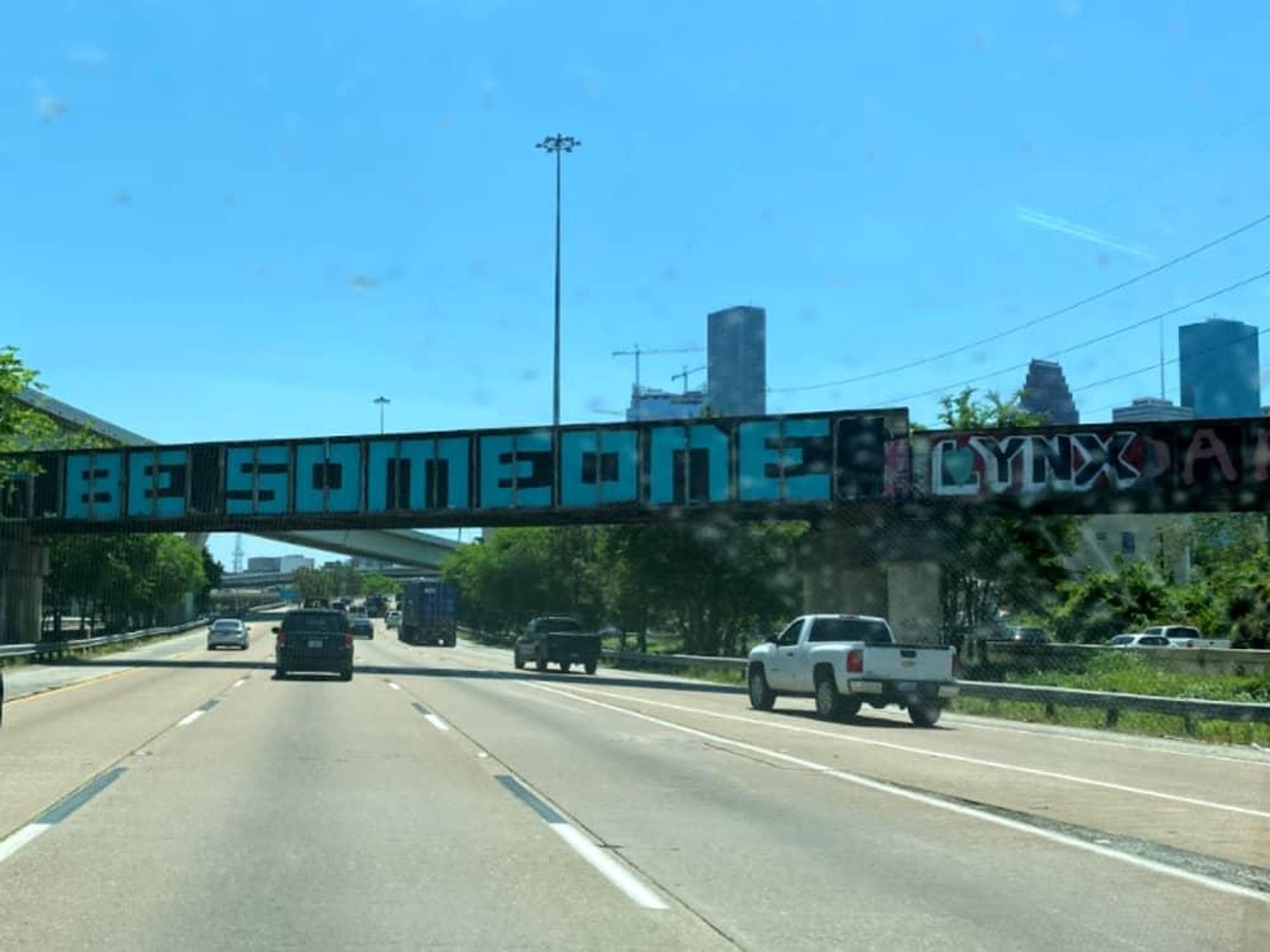 Be Someone sign downtown