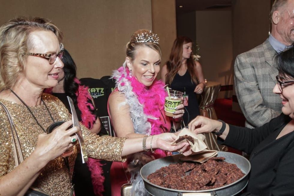 Becky McAndrews, Joan Cohe, Adrienne Brown-Franklin samle cat shit cookies at Sweet Potato Queens party