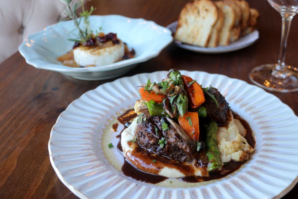 Beef short ribs on a white plate