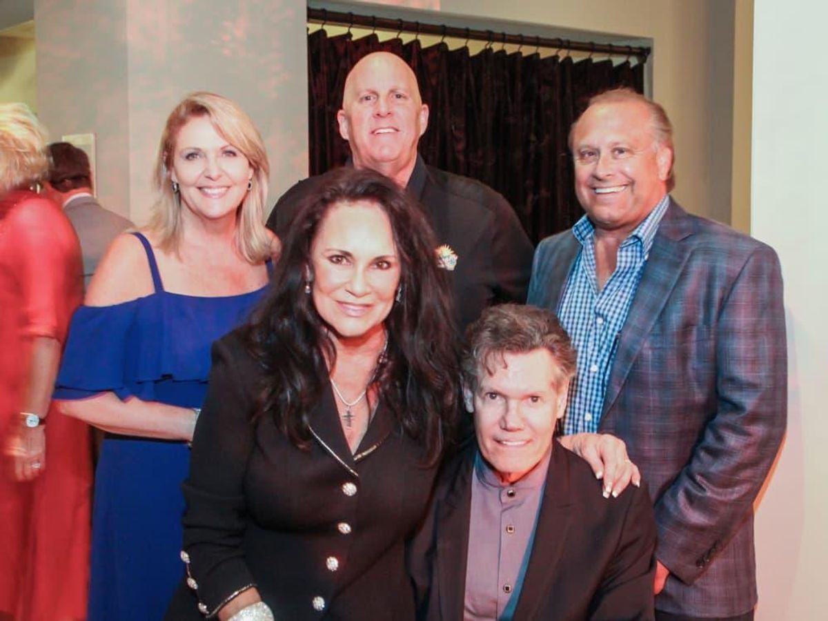 Front row: Mary and Randy Travis; back row: Tinti Moffat, Mike Malone ...