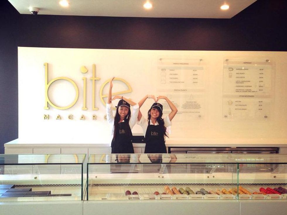 Bite Macarons Houston girls spelling out b and m