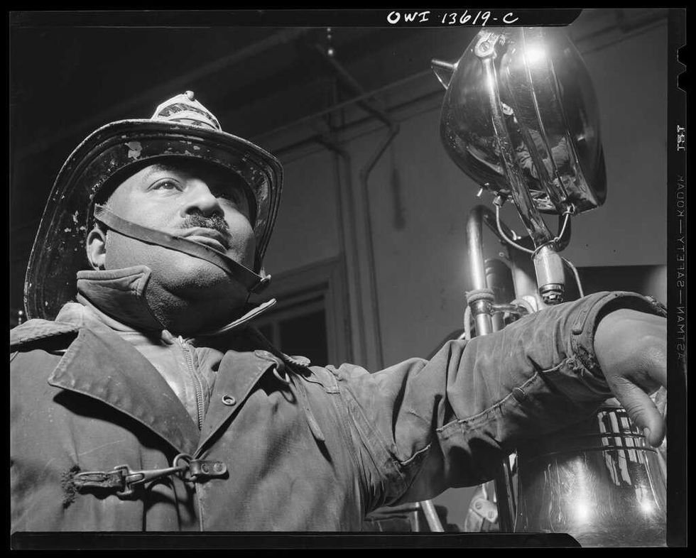 Blac and white photo of a black fireman from 1943 by Gordon Parks