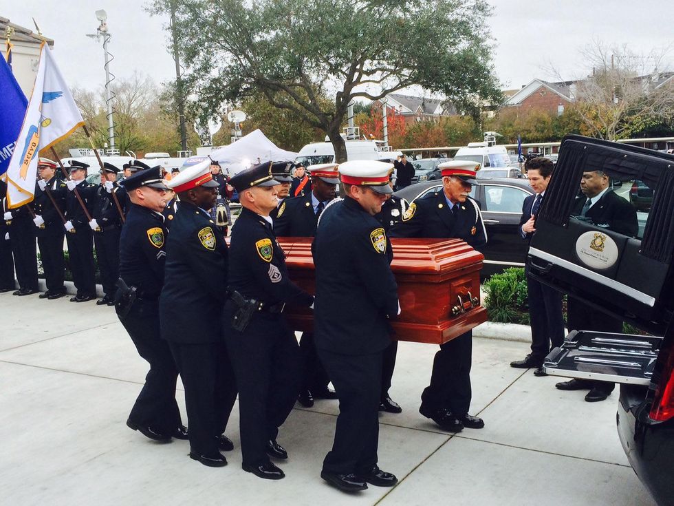 Bob Lanier casket is moved to hearse at his funeral