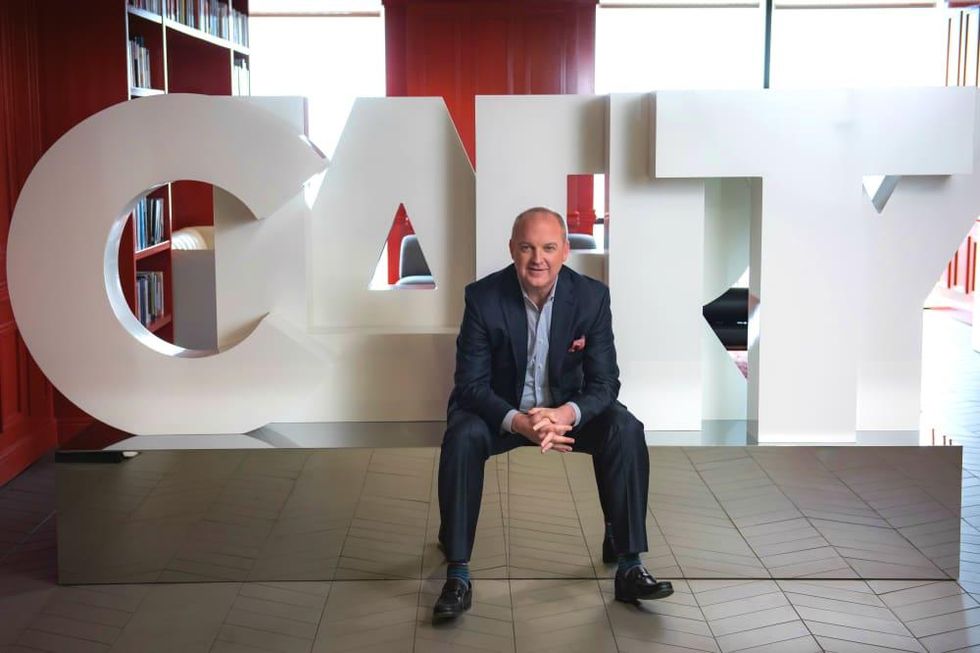 Brad Deutser in front of clarity sign