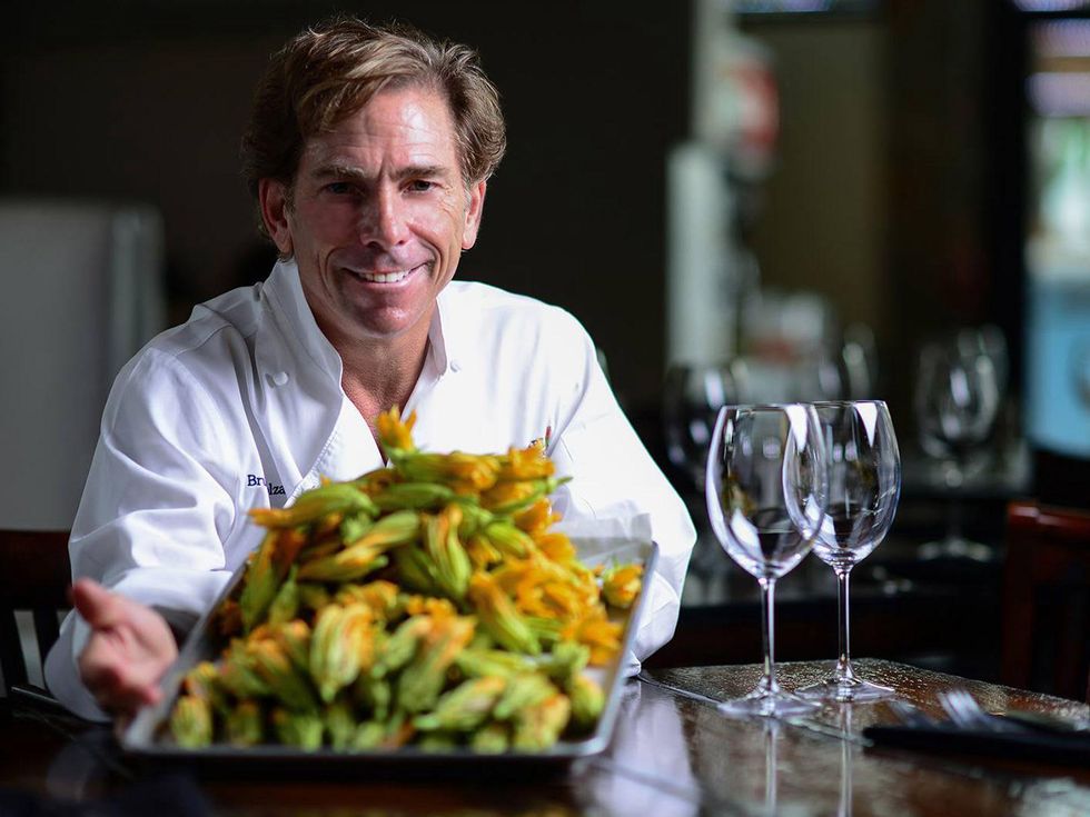 Bruce Molzan Corner Table chef with squash blossoms June 2014