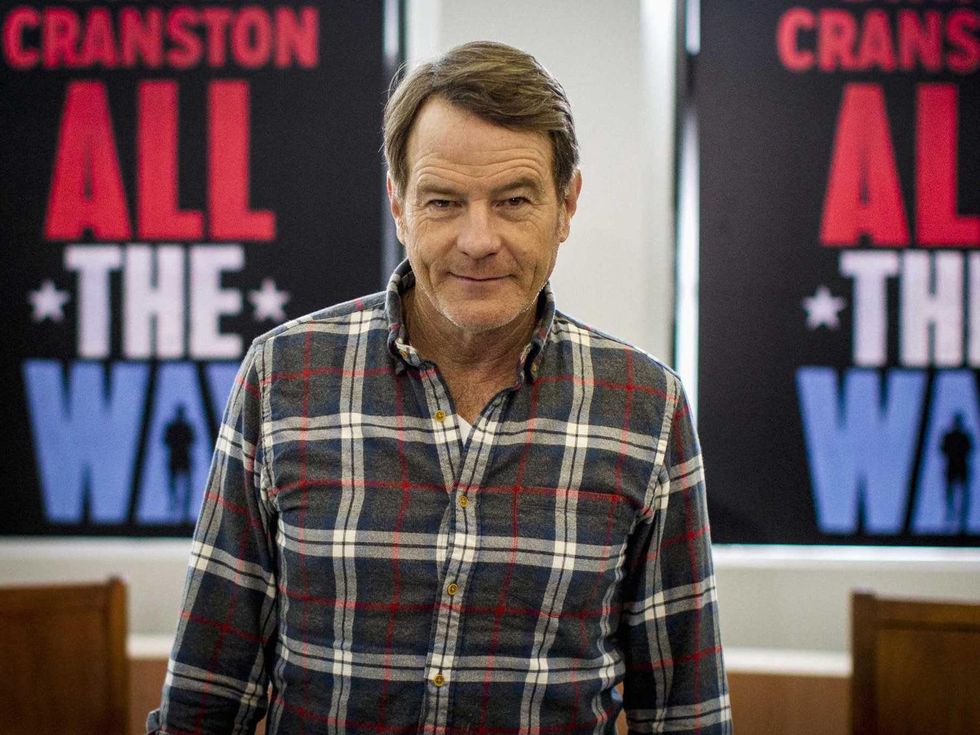 Bryan Cranston in front of All the Way posters