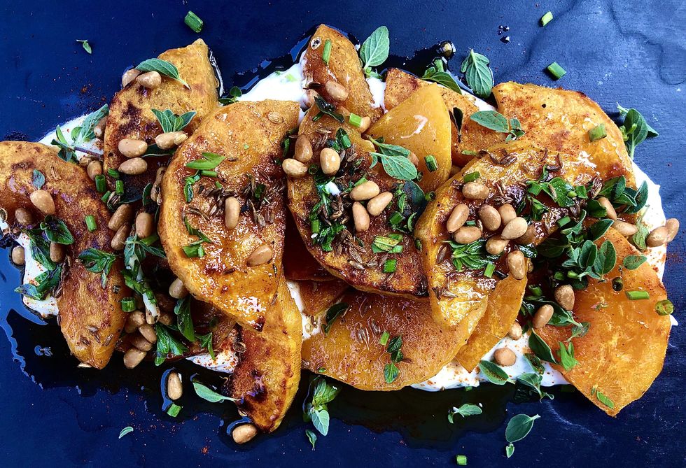 Butternut squash on a plate with pine nuts