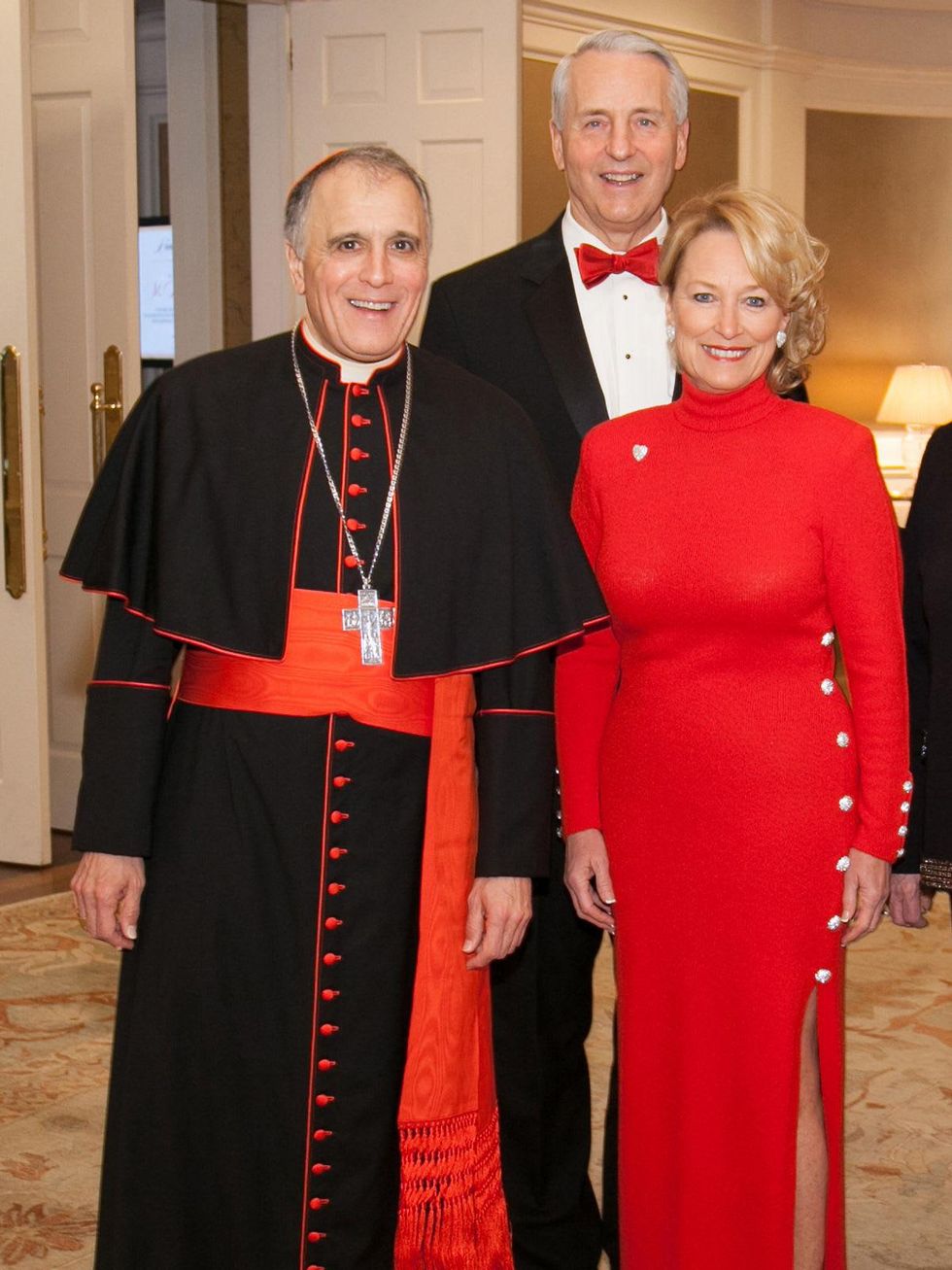Cardinal Daniel DiNardo, from left, with Bob and Marianne Ivany at the University of St. Thomas Mardi Gras March 2014
