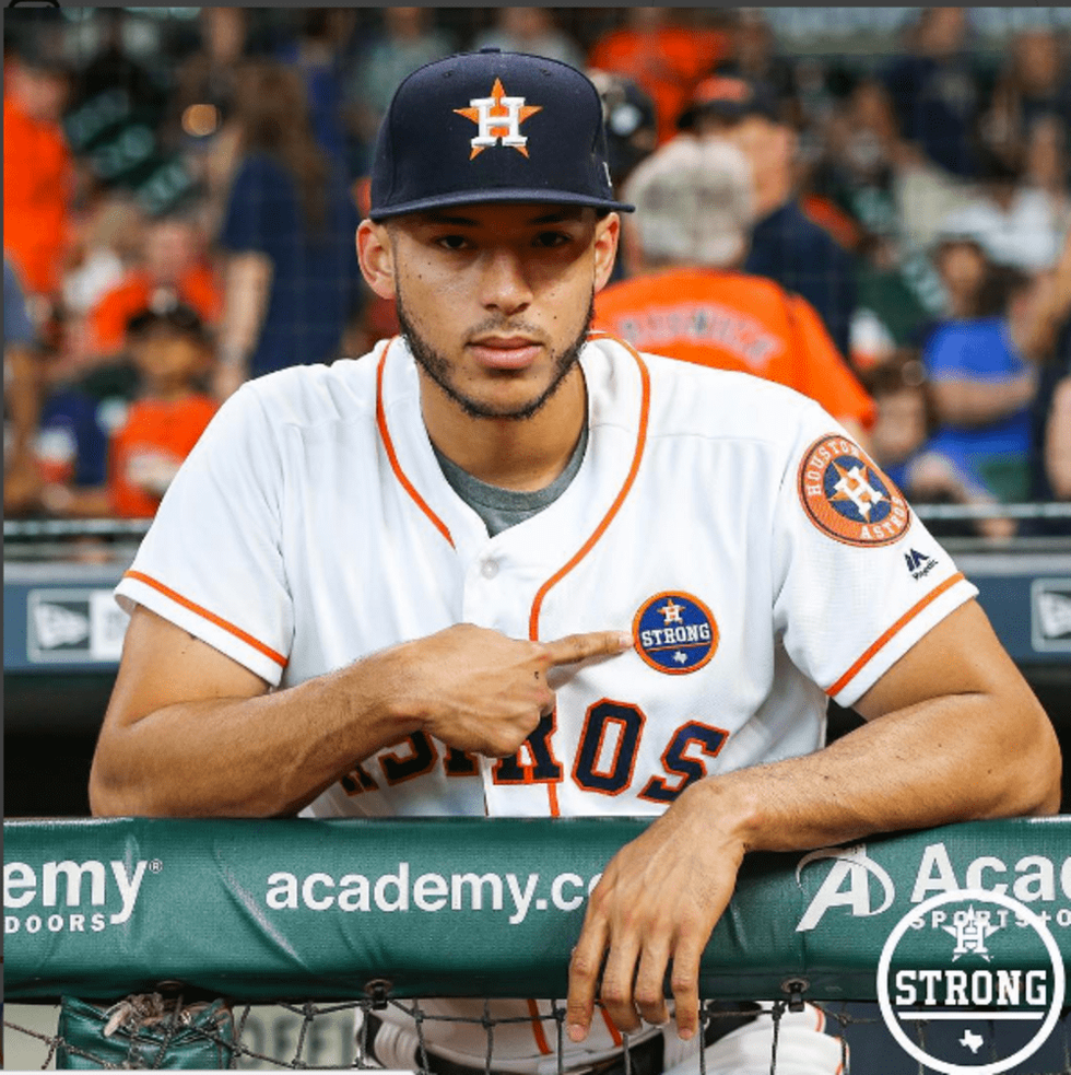 Carlos Correa points out Houston Astros Strong logo