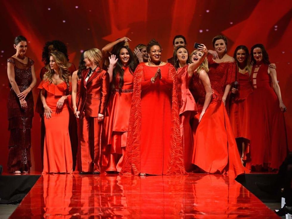 Celebrity models walk the runway at the American Heart Association's Go Red For Women Red Dress Collection 2017 p
