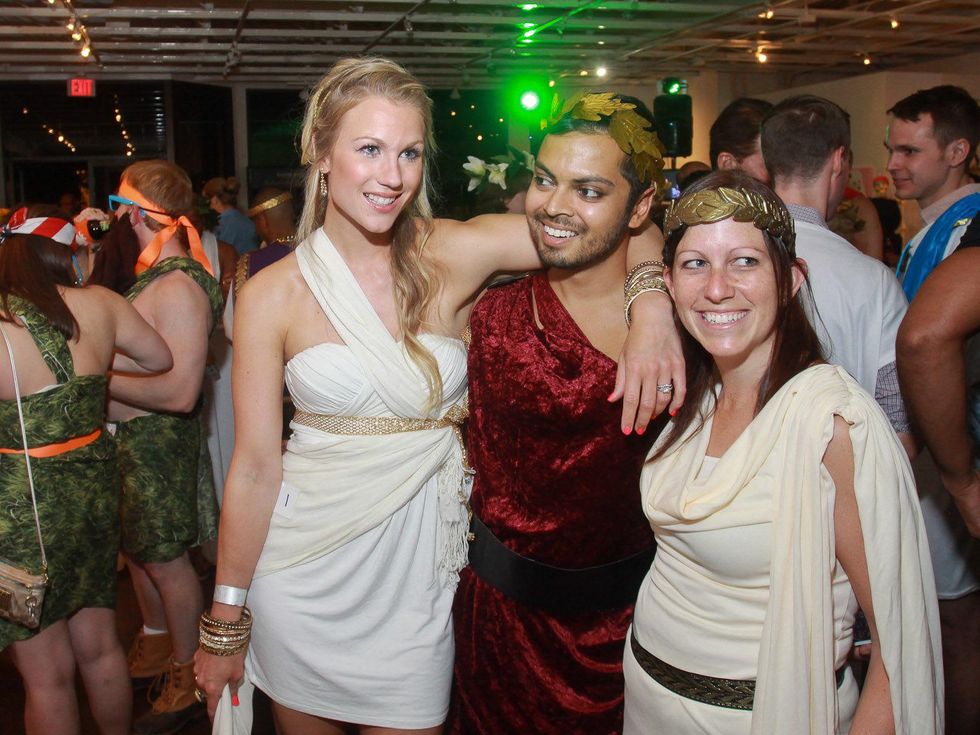 Celia Vrnak, from left, Maneesh Singal and Gayle Abrahams at toga party at Craft Salon benefiting Bering Omega