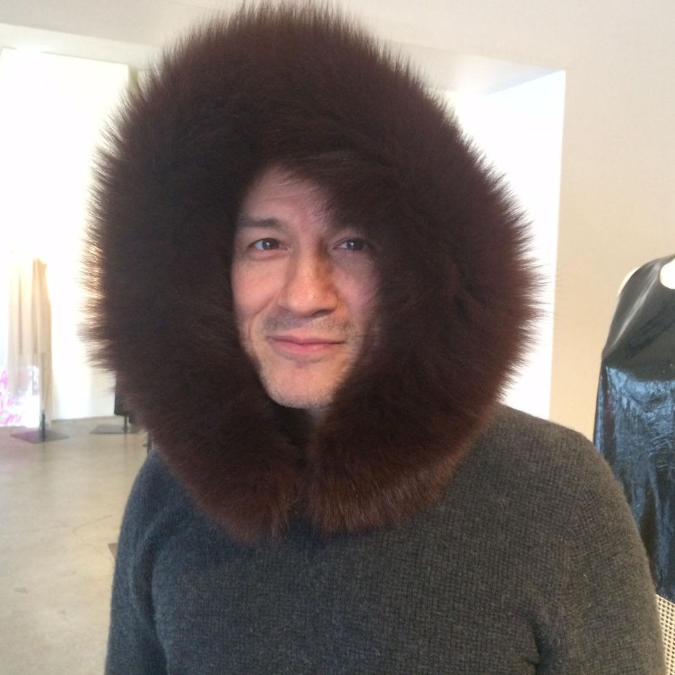 Cesar Galindo in fur hoodie at Sloan Hall