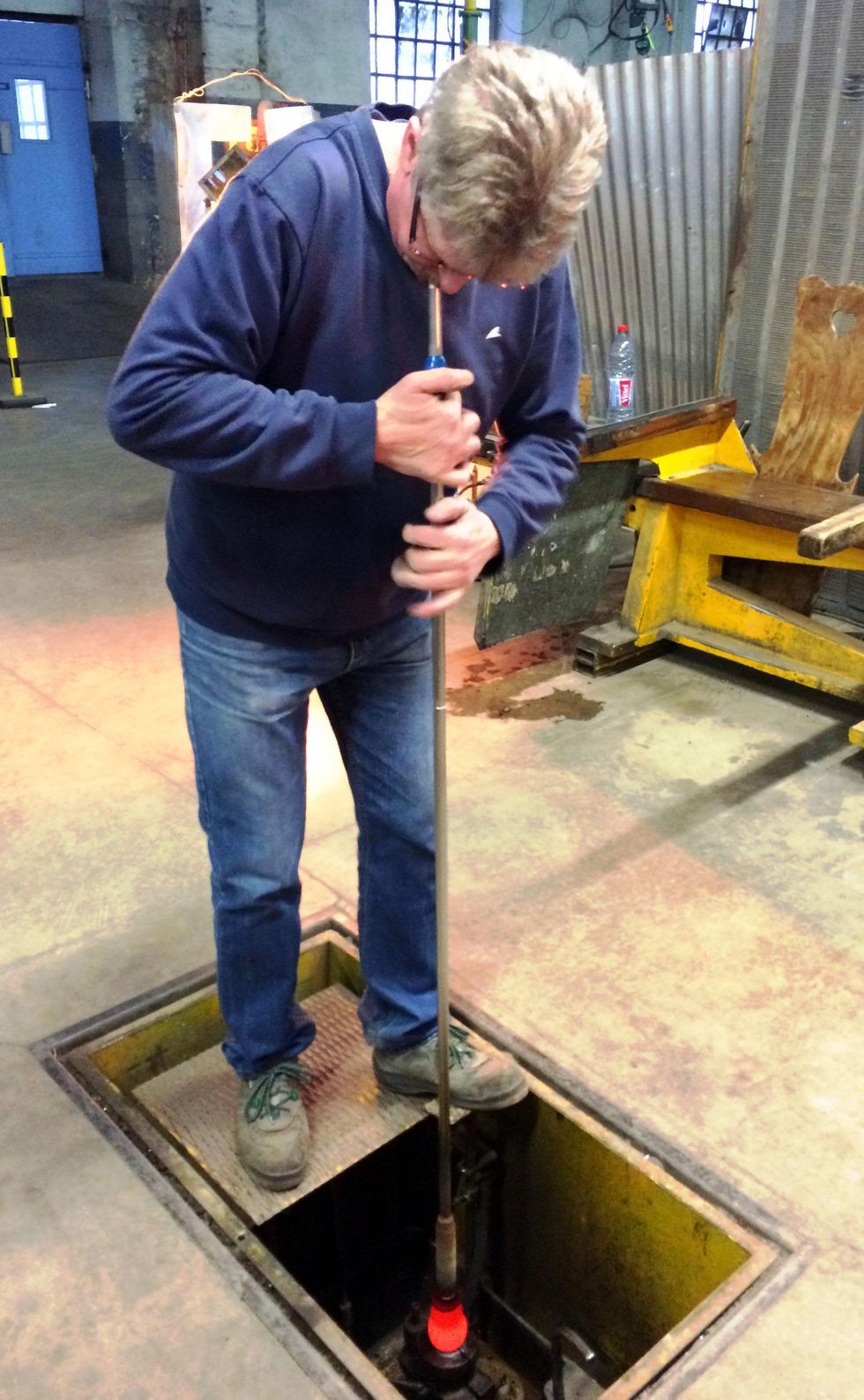 Cherri Carbonara Baccarat factory tour April 2015 Baccarat artisan blowing glass into a mold mounted in the floor