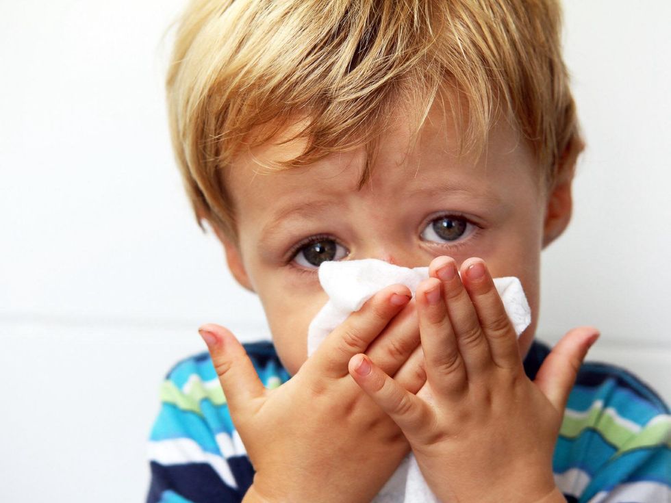 child, blowing nose, sick