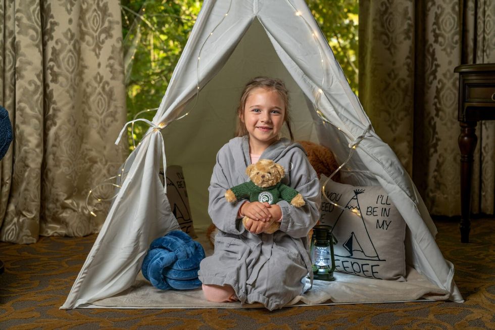 Child in the Holidy Hideout tent offered by the Houstonian