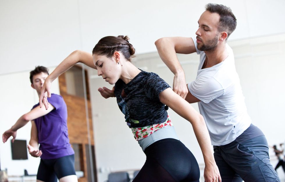 Choreographer Garrett Smith works with Houston Ballet dancers Katharine Precourt and William Newton.