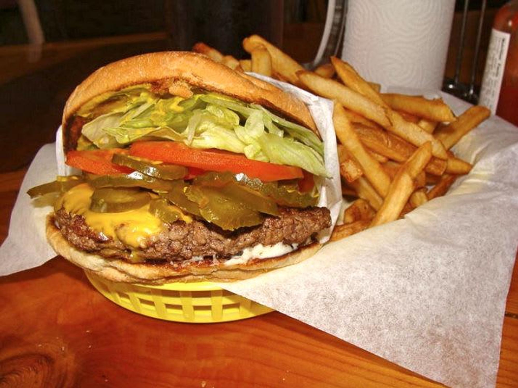 Christian's Tailgate Bar and Grill japaleno cheese burger with crispy fries