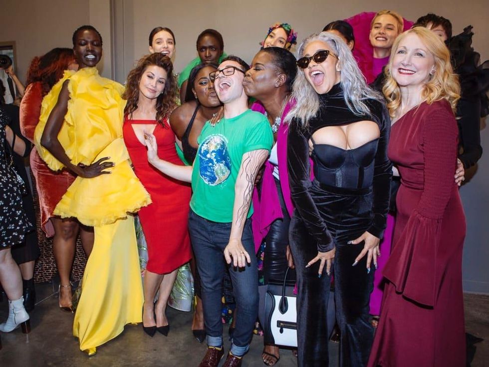 Christian Siriano, center, surrounded by stars including Leslie Jones after runway show at New York Fashion Week