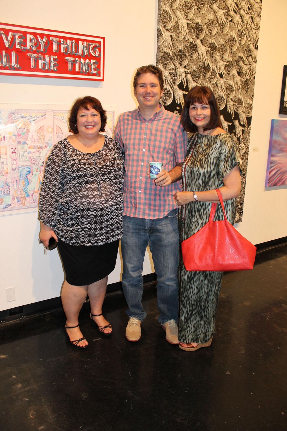 Christine West, from left, with Mark and Jenny Johnson at the Lawndale Big Show preview party July 2014