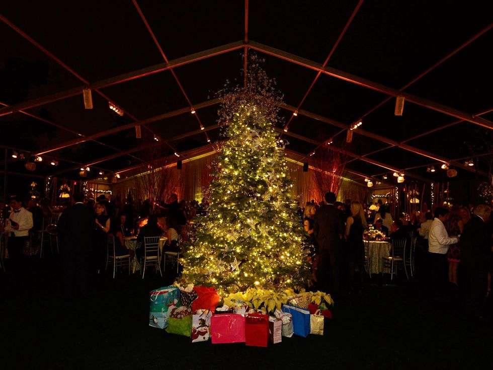 Christmas tree with gifts at the Texas Children's Ambassadors Holiday Party December 2013