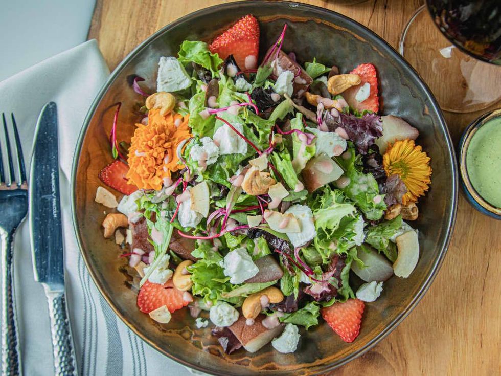 City Cellars salad with strawberries, poached pears, and goat cheese.