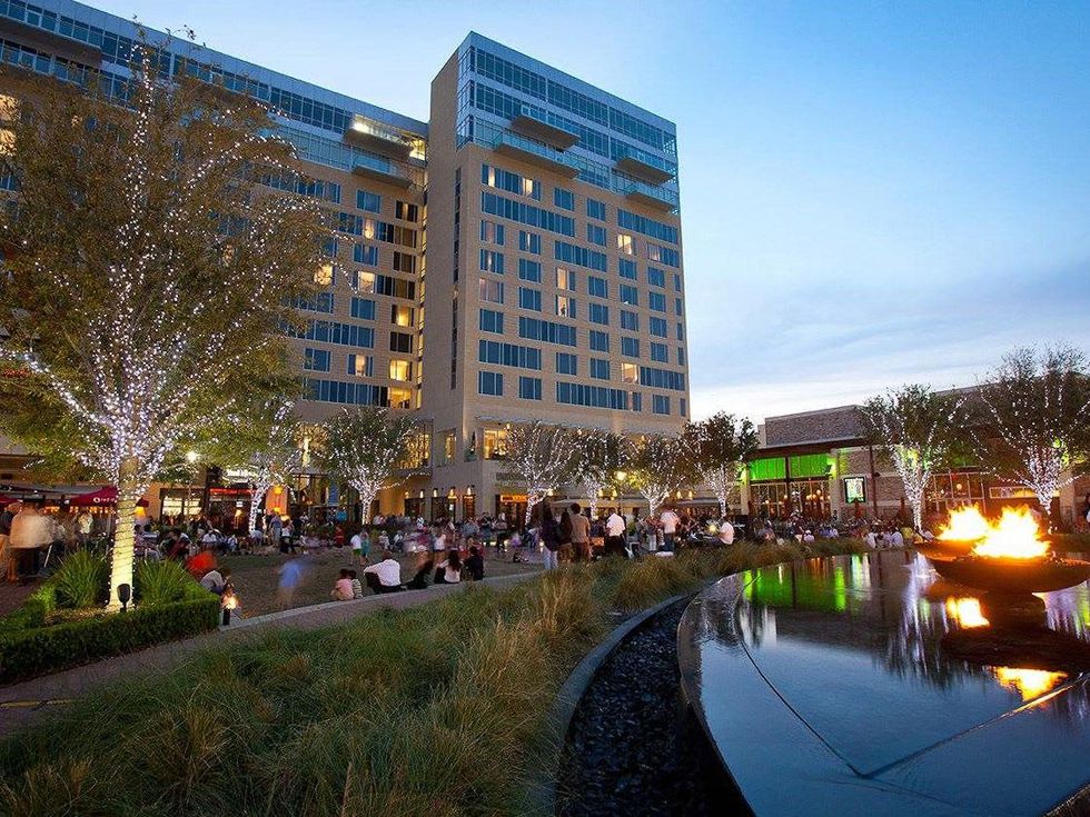 CityCentre Houston lawn with lots of people at night