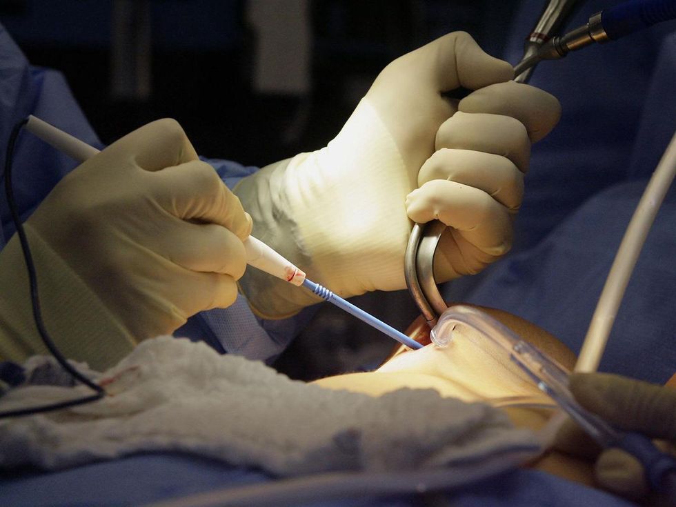 cosmetic surgery surgeon with tools