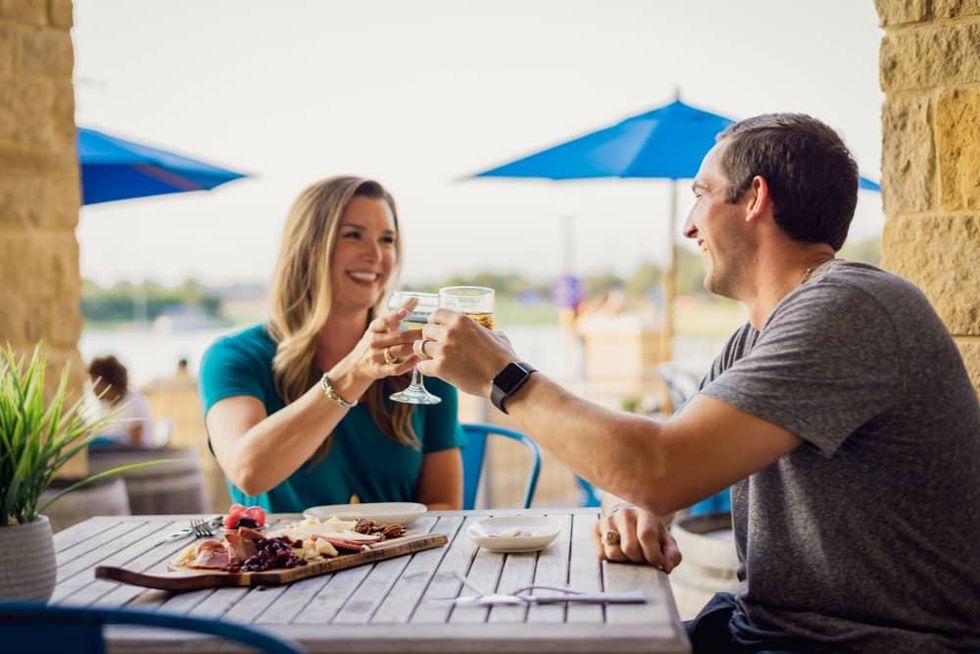 Couple dining at Flying Vine at The Boardwalk at Towne Lake