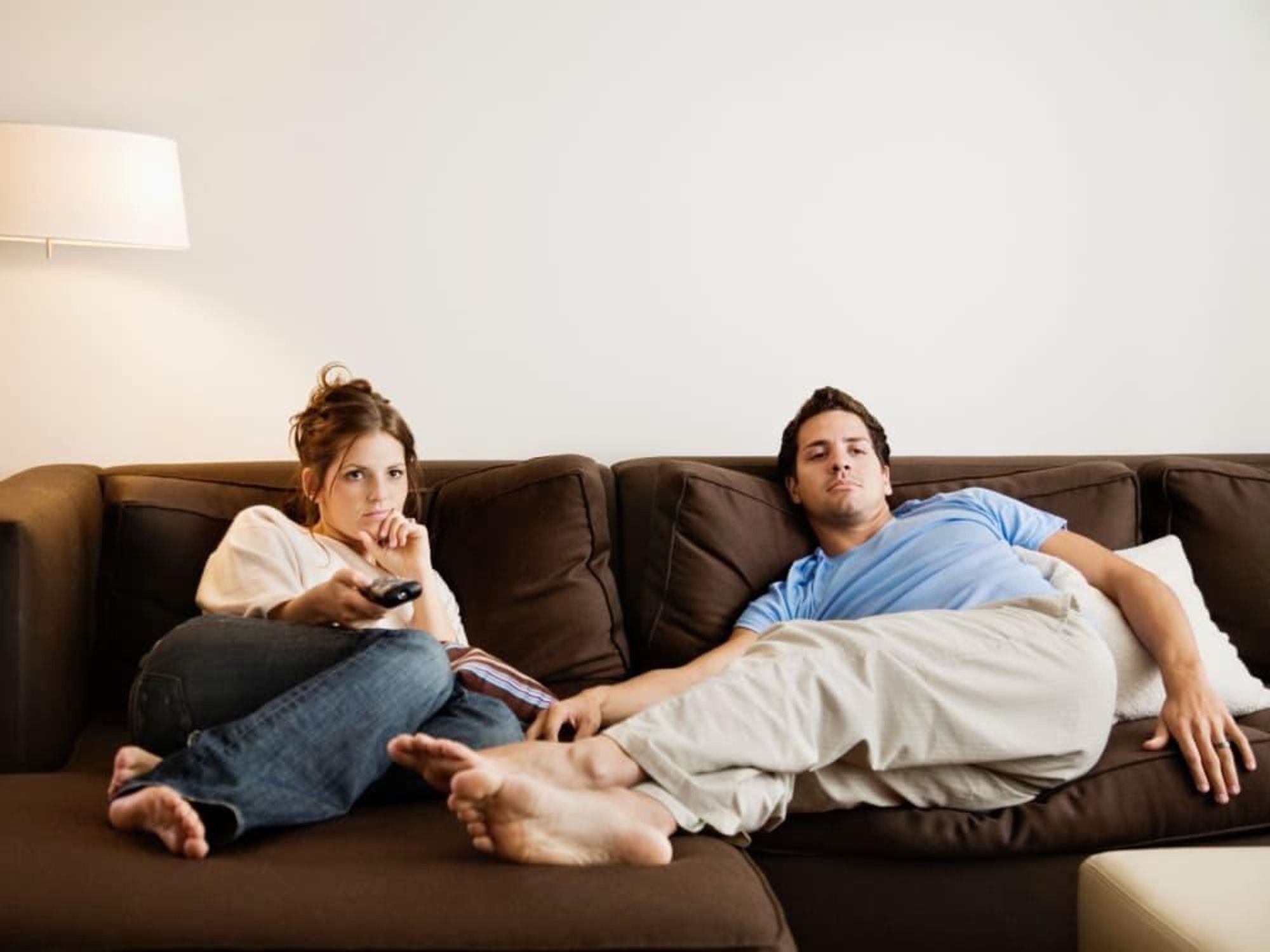 couple on couch, watching tv, homebodies