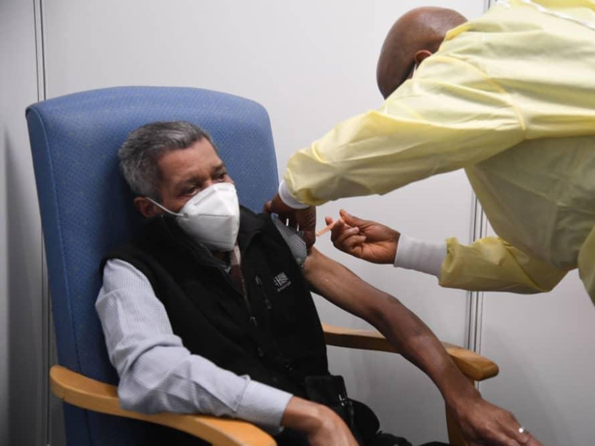 COVID-19 vaccine man getting shot doctor