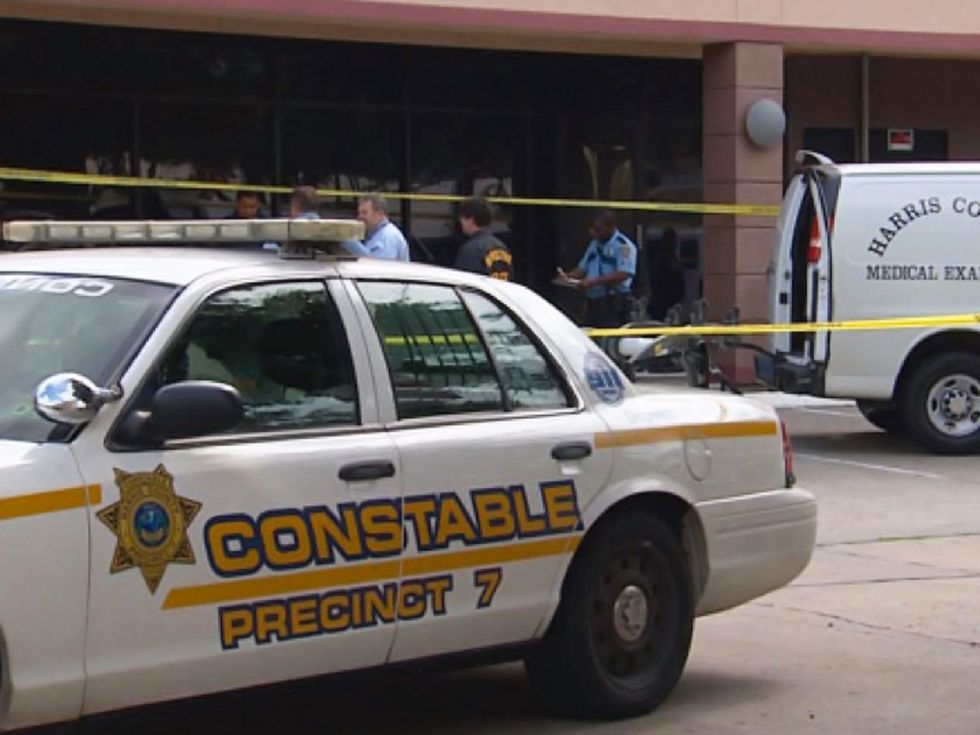 crime scene police cars where people were taking photos of dead Houston homeless man October 2013